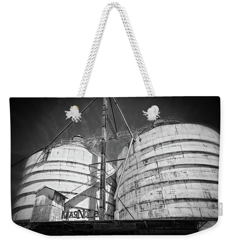 The Silos Weekender Tote Bag featuring the photograph Magnolia Silos in Black and White by Lynn Bauer