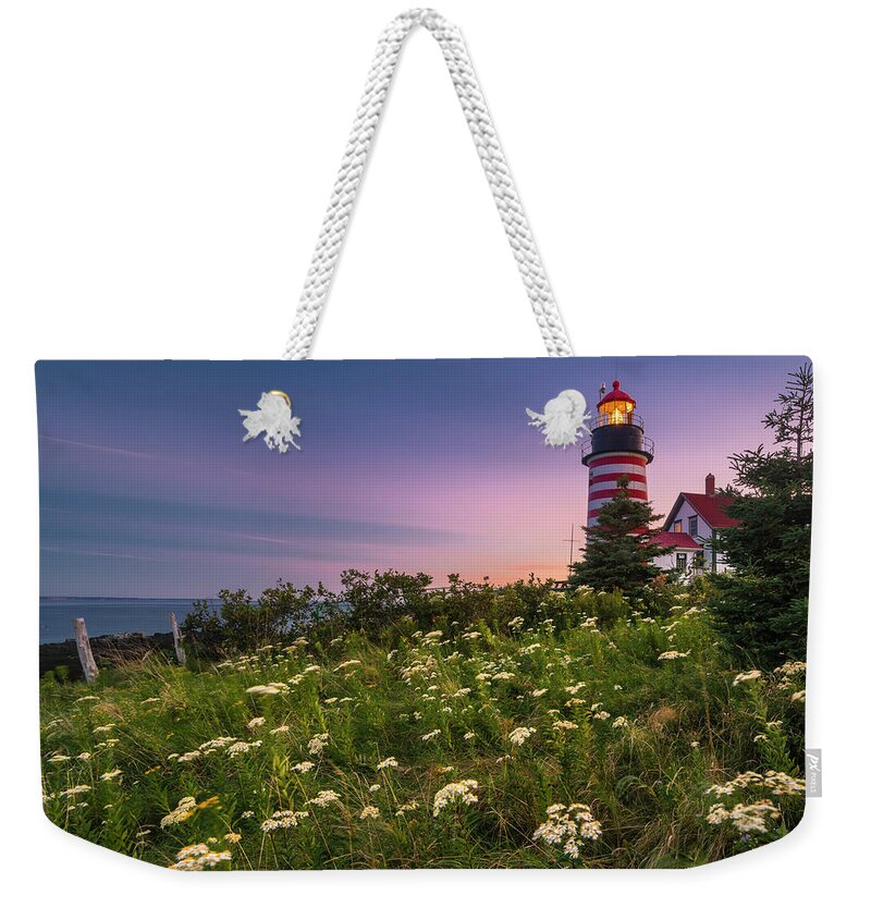 Maine Weekender Tote Bag featuring the photograph Maine West Quoddy Head Lighthouse Sunset by Ranjay Mitra
