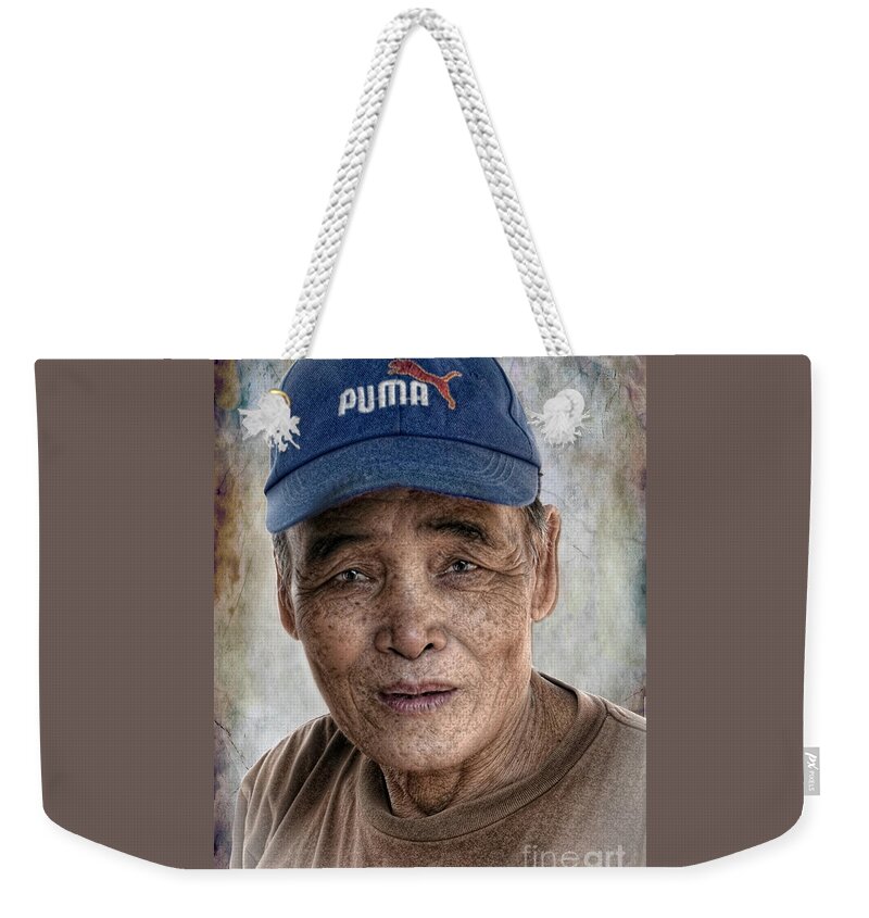 Thailand Weekender Tote Bag featuring the digital art Man In The Cap by Ian Gledhill