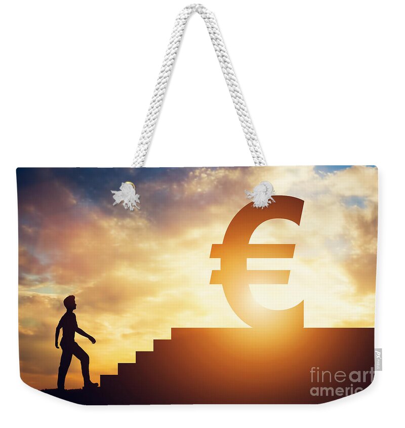 Man Weekender Tote Bag featuring the photograph Man standing in front of stairs with euro sign on top by Michal Bednarek