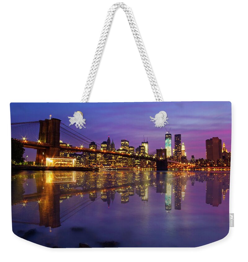 America Weekender Tote Bag featuring the photograph Manhattan Reflection by Mircea Costina Photography