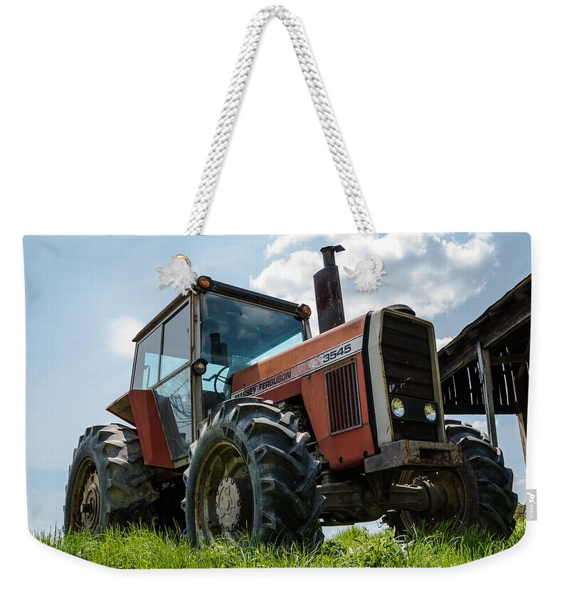Massey Ferguson Weekender Tote Bag featuring the photograph Massey Ferguson 3545 by Holden The Moment