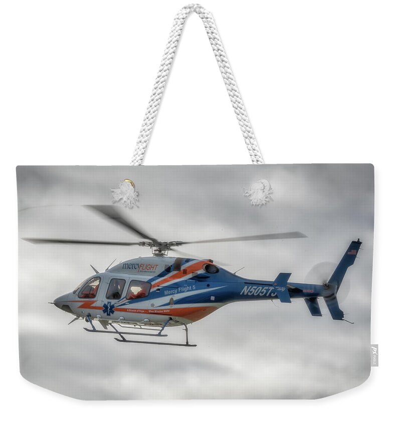 Air Travel Weekender Tote Bag featuring the photograph Mercy Flight 5 by Guy Whiteley