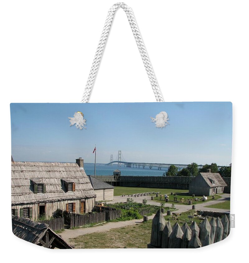 Colonial Michilmackinac Weekender Tote Bag featuring the photograph Michilimackinac and Mackinac Bridge by Keith Stokes