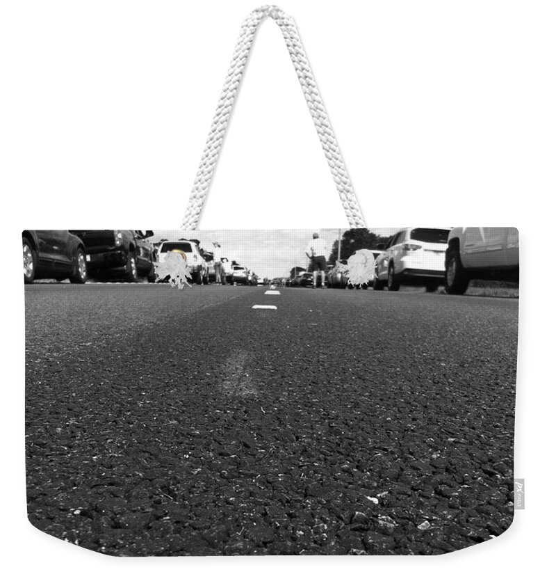  Weekender Tote Bag featuring the photograph Middle of street by WaLdEmAr BoRrErO