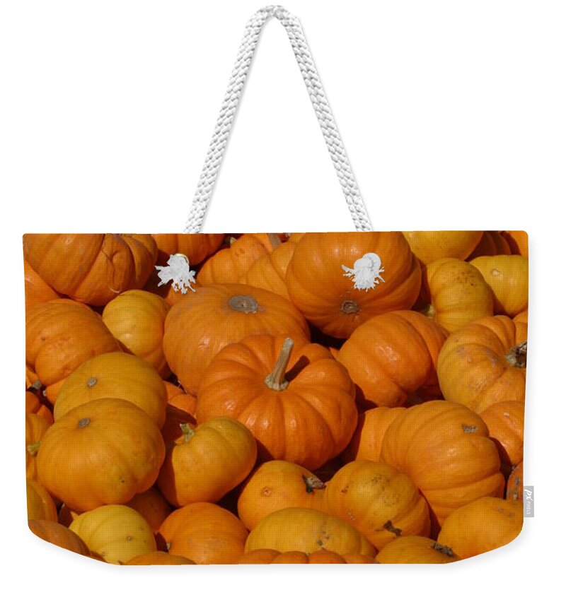 Orange Weekender Tote Bag featuring the photograph Mini Pumpkins by Jeff Floyd