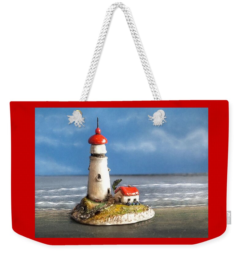 Lighthouse Weekender Tote Bag featuring the photograph Miniature Lighthouse by Wendy McKennon