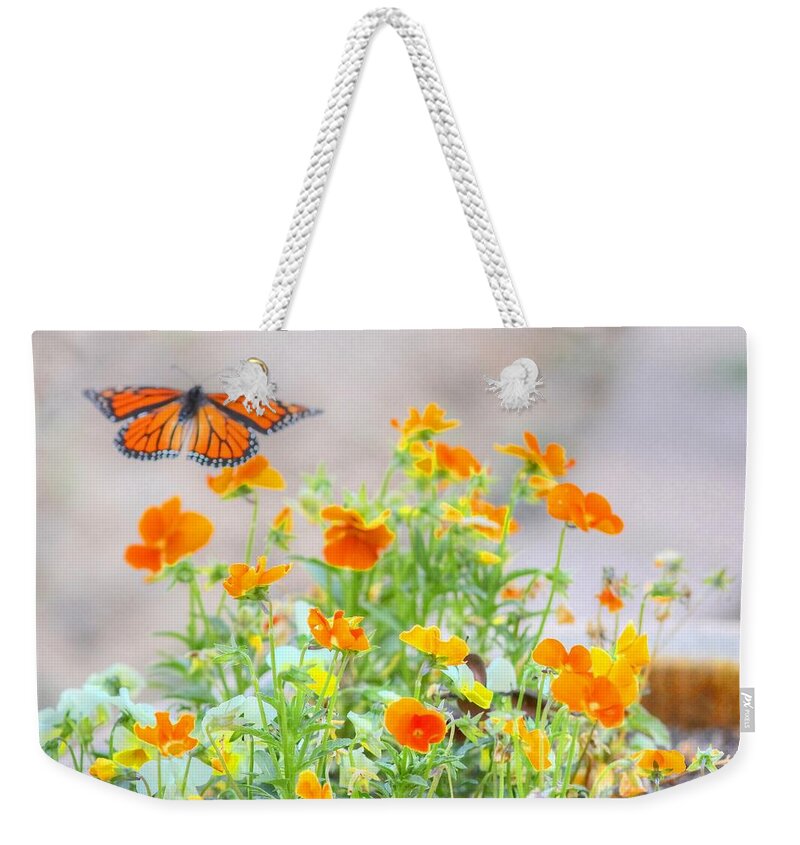 Butterfly Weekender Tote Bag featuring the photograph Monarch Butterfly in the Flowers by Liz Vernand