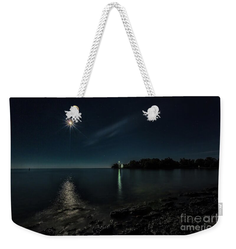Blue Weekender Tote Bag featuring the photograph Moonllight over Pointe Traverse by Roger Monahan