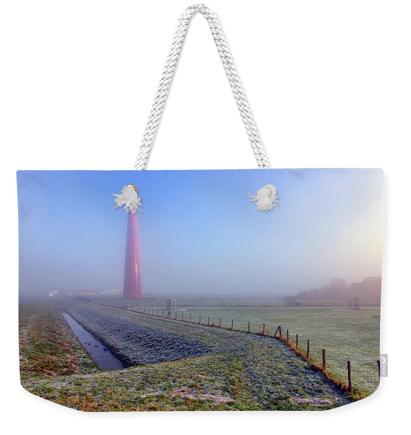Lange Jaap Lighthouse Weekender Tote Bag featuring the photograph Morning Mist by Nadia Sanowar