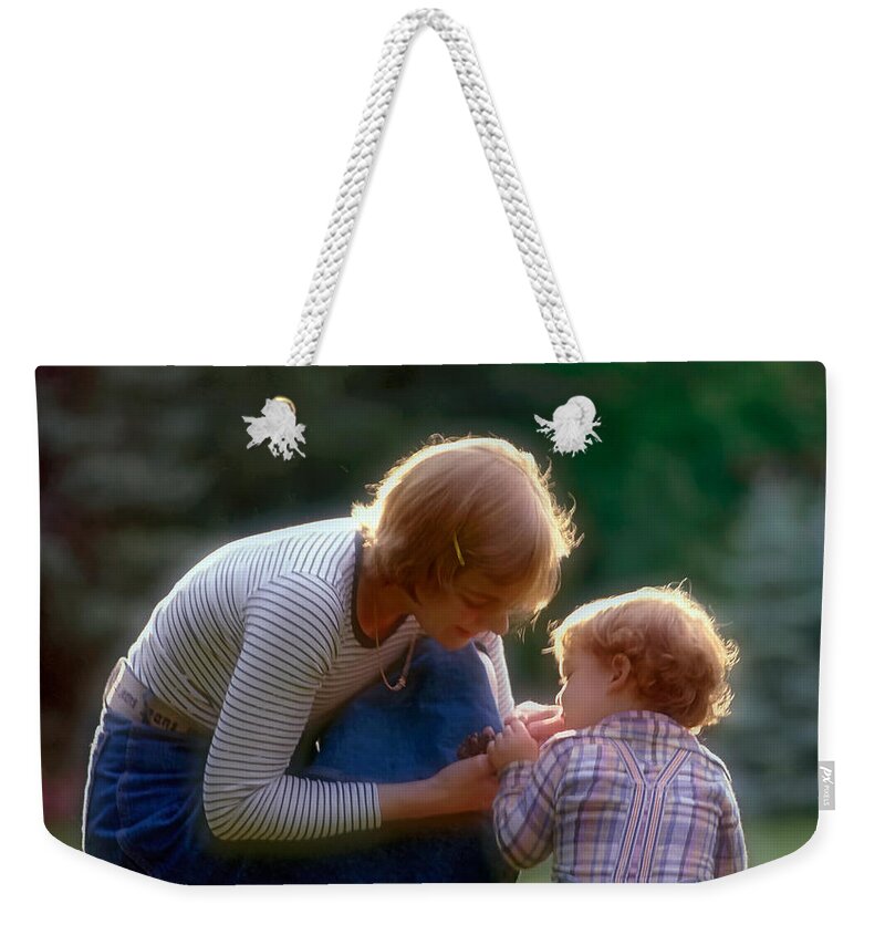 Mother And Son Weekender Tote Bag featuring the photograph Mother with kid by Juan Carlos Ferro Duque