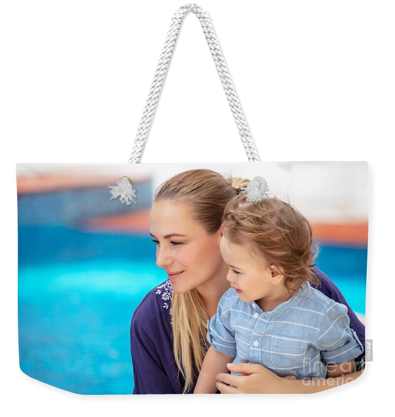 Baby Weekender Tote Bag featuring the photograph Mother with son near pool by Anna Om
