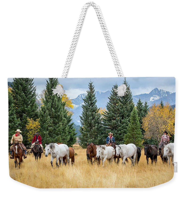 Cowboys Weekender Tote Bag featuring the photograph Moving the Herd by Jack Bell