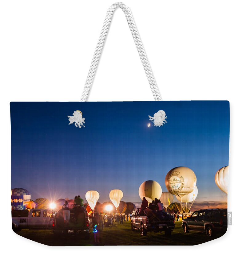 Multiple Hot Air Balloons Weekender Tote Bag featuring the photograph Multiple Hot air Balloons night glow by Charles McCleanon