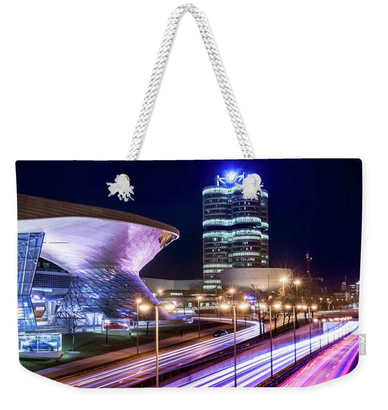 Bmw Weekender Tote Bag featuring the pyrography Munich - BMW city at night by Hannes Cmarits