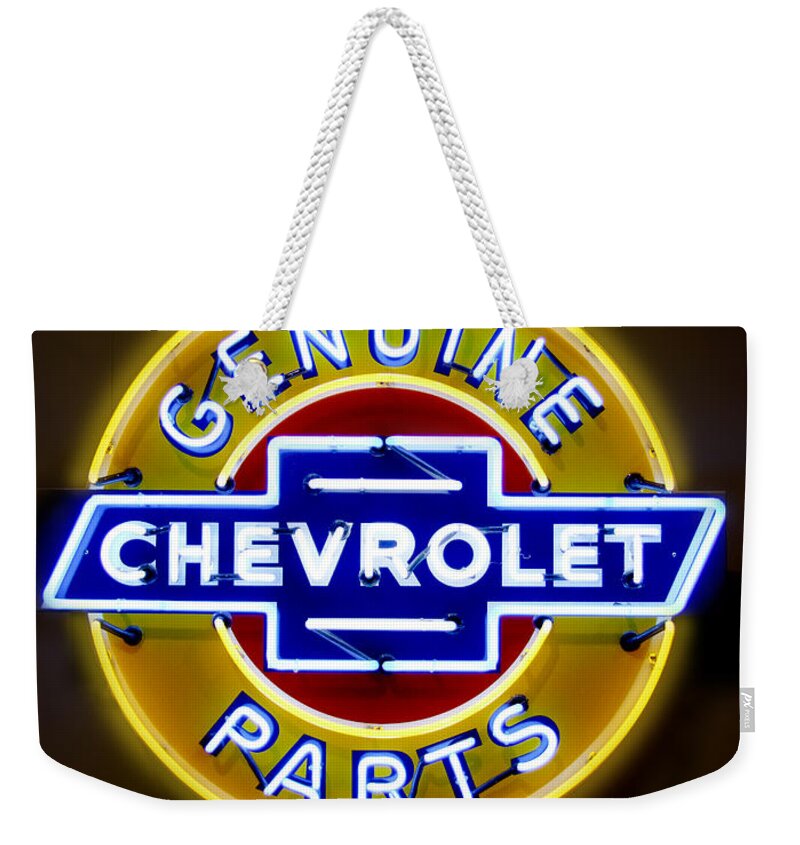 Neon Sign Weekender Tote Bag featuring the photograph Neon Genuine Chevrolet Parts Sign by Mike McGlothlen