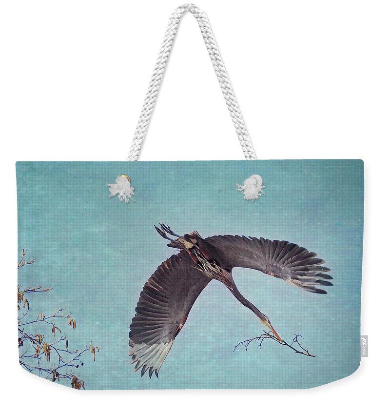 Heron Weekender Tote Bag featuring the photograph Nesting Heron in Flight by Peggy Collins