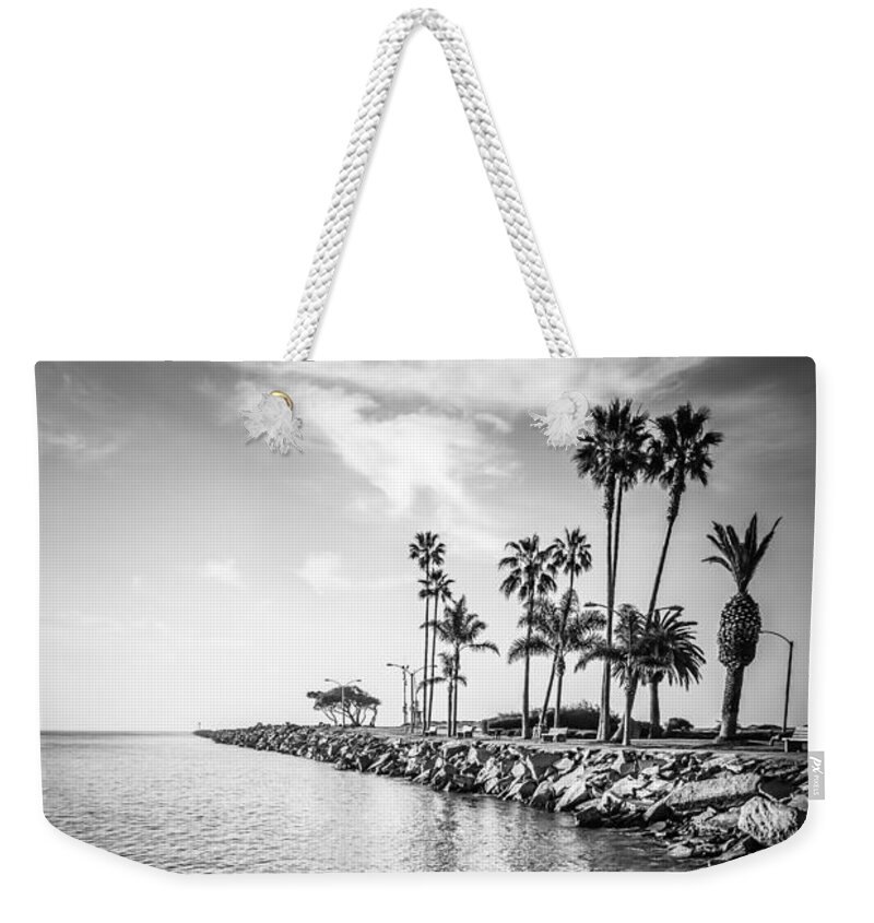 America Weekender Tote Bag featuring the photograph Newport Beach Jetty Black and White Photo by Paul Velgos