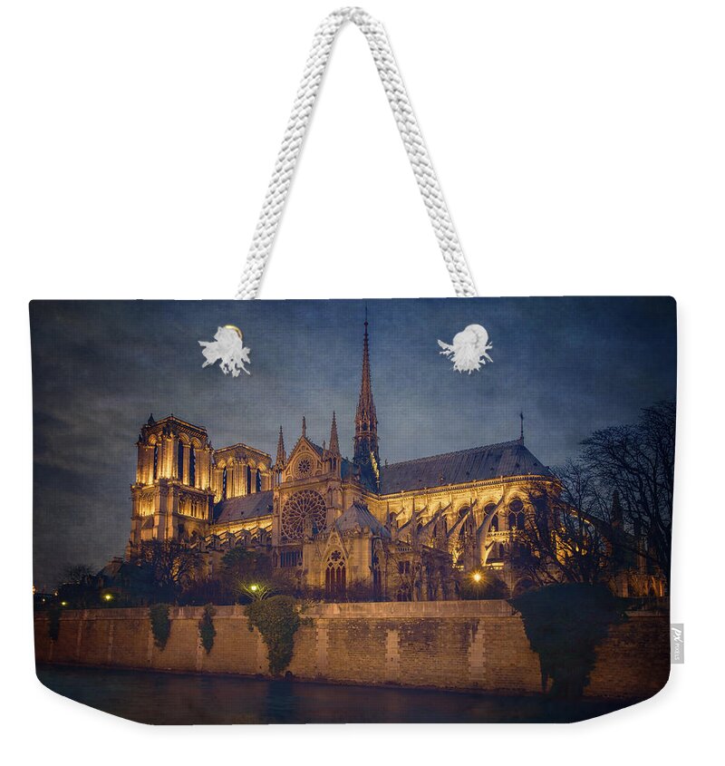 Joan Carroll Weekender Tote Bag featuring the photograph Notre Dame on the Seine Textured by Joan Carroll