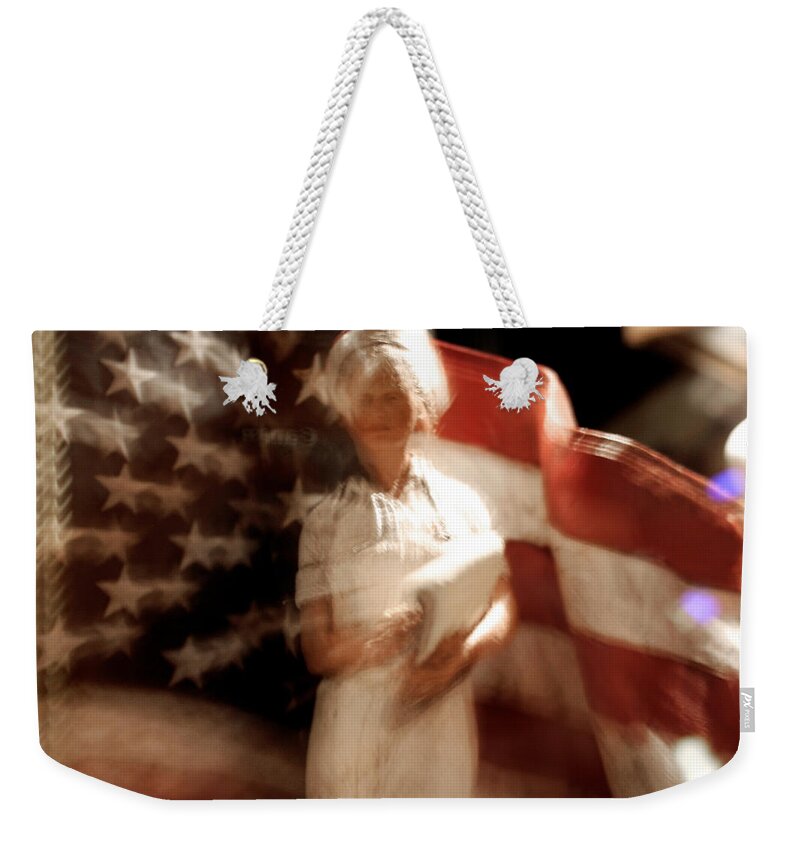 Motion Weekender Tote Bag featuring the photograph Nursing America by Ric Bascobert