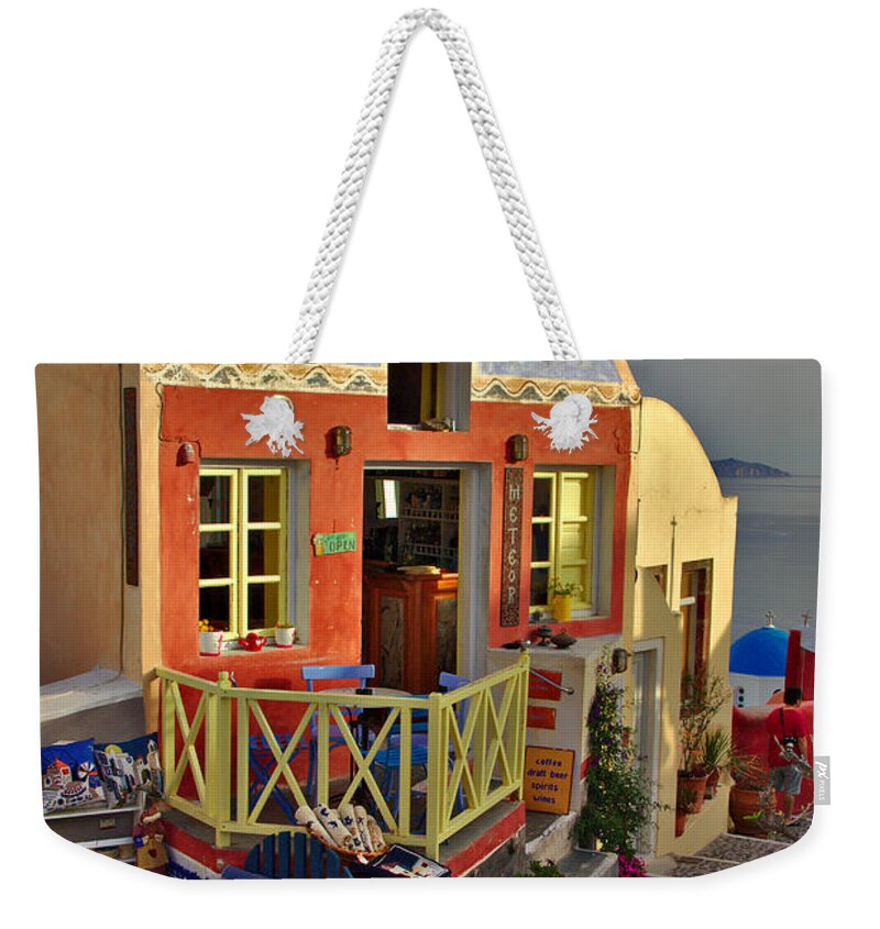 Santorini Weekender Tote Bag featuring the photograph Oia Pub by Jeremy Hayden