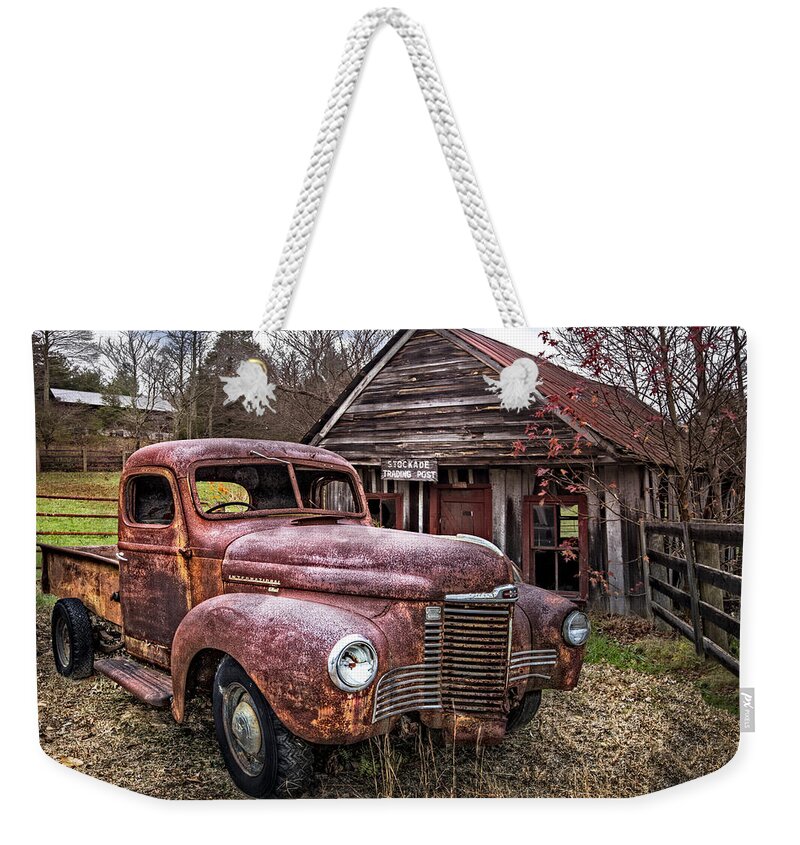 1930s Weekender Tote Bag featuring the photograph Old and Rusty by Debra and Dave Vanderlaan