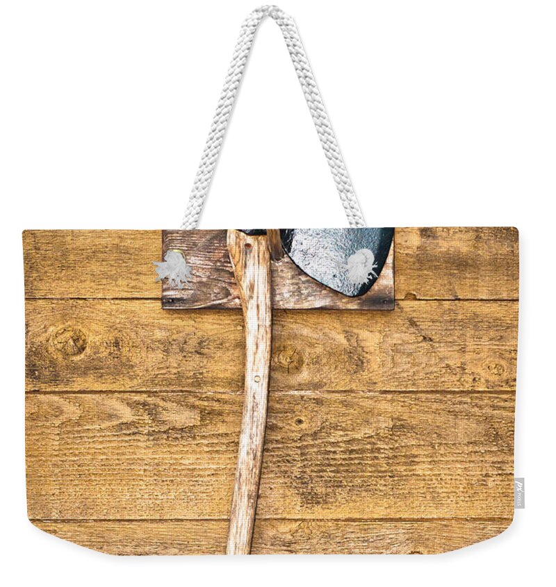 Antique Weekender Tote Bag featuring the photograph Old axe by Tom Gowanlock