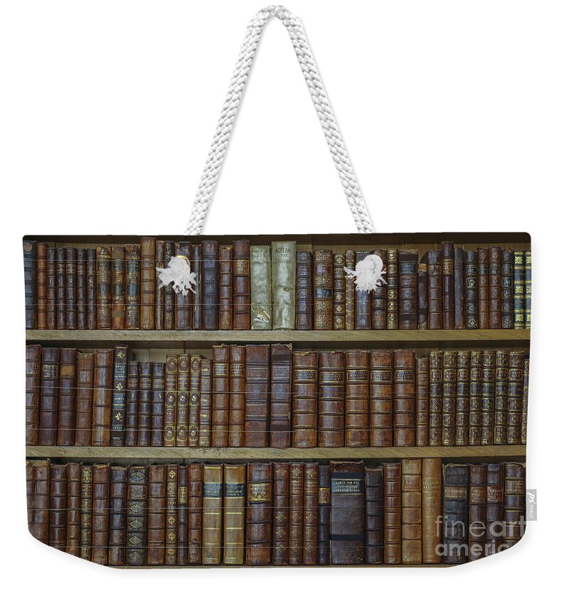 Book Weekender Tote Bag featuring the photograph Old books by Patricia Hofmeester