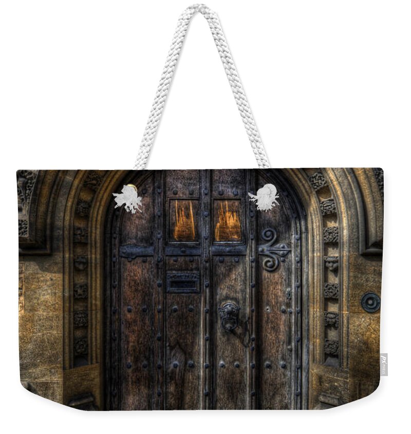 Yhun Suarez Weekender Tote Bag featuring the photograph Old College Door - Oxford by Yhun Suarez