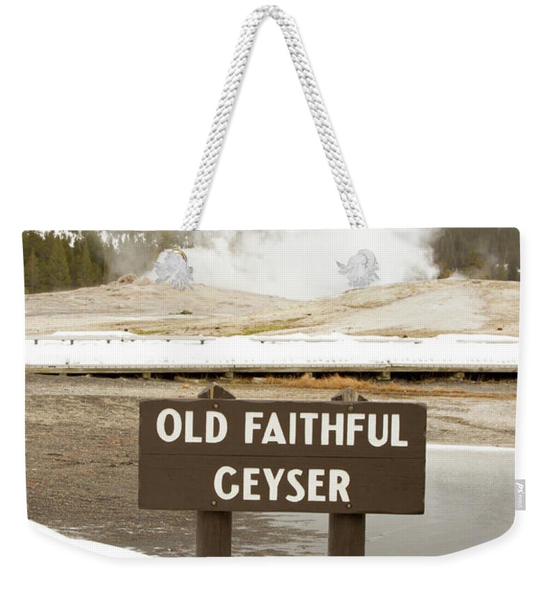 America Weekender Tote Bag featuring the photograph Old Faithful Geyser with sign, Yellowstone National Park, Wyomin by Karen Foley