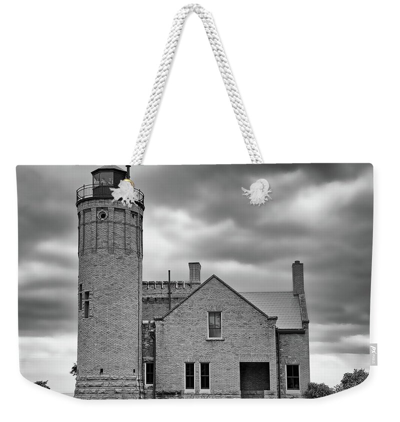 Light House Weekender Tote Bag featuring the photograph Old Mackinac Point Light Gray Day BW by Mary Bedy