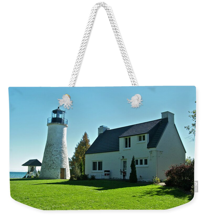 Old Weekender Tote Bag featuring the photograph Old Presque Isle Lighthouse_9480 by Michael Peychich
