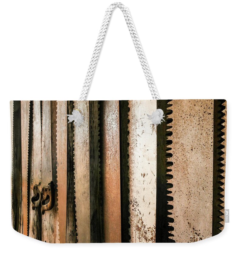 Retired Rusted Cross Saws Weekender Tote Bag featuring the photograph Retired Rusted Saws by Lexa Harpell