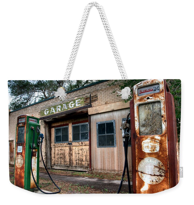 No People Weekender Tote Bag featuring the photograph Old Service Station by Brett Pelletier