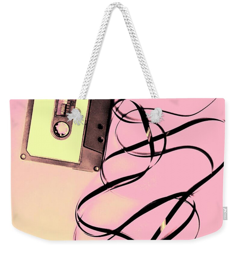 Cassette Weekender Tote Bag featuring the photograph Old tape on pink background by Jorgo Photography