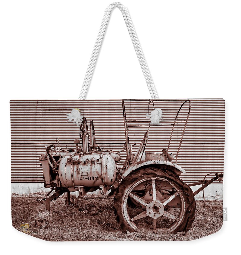 Hawaii Weekender Tote Bag featuring the photograph Old Tractor Against Quonset Hut by Jim Thompson