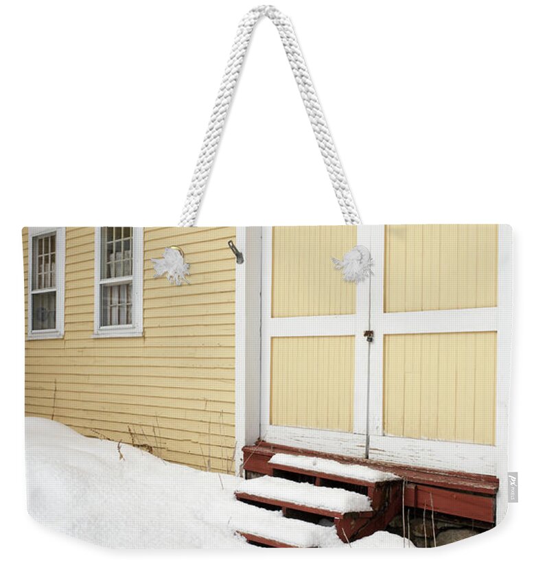 New Hampshire Weekender Tote Bag featuring the photograph Old Yellow Farm House in Winter Croydon New Hampshire by Edward Fielding
