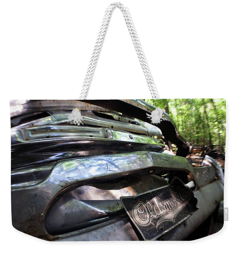 Oldsmobile Weekender Tote Bag featuring the photograph Oldsmobile Bumper Detail by Matthew Mezo