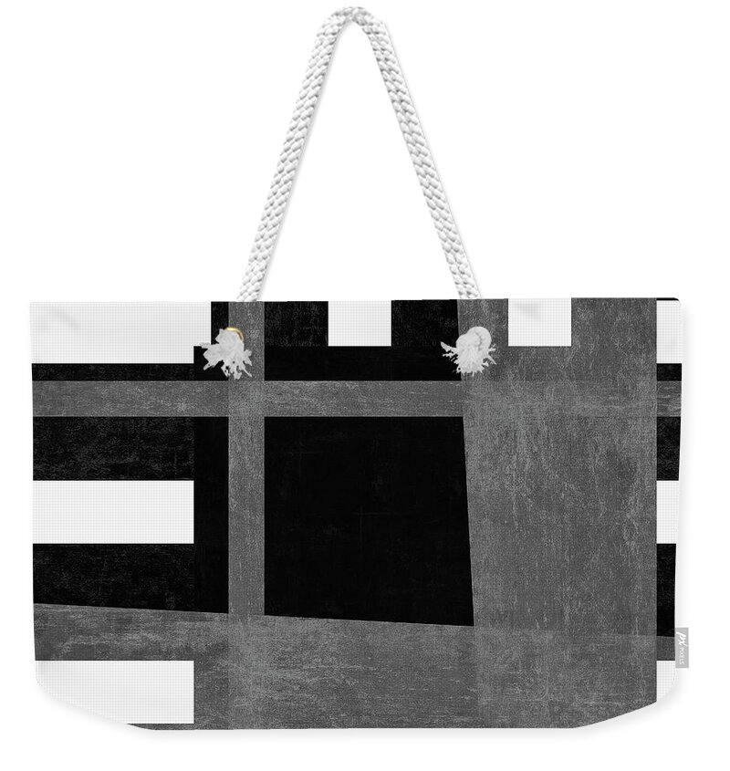 Strong Weekender Tote Bag featuring the photograph On the Tarmac Designer Series 3A12BW by Carol Leigh