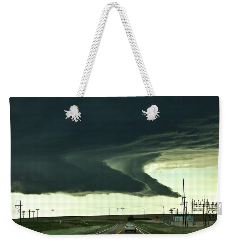 Colorado Weekender Tote Bag featuring the photograph On the way to the Akron CO Beast by Ryan Crouse