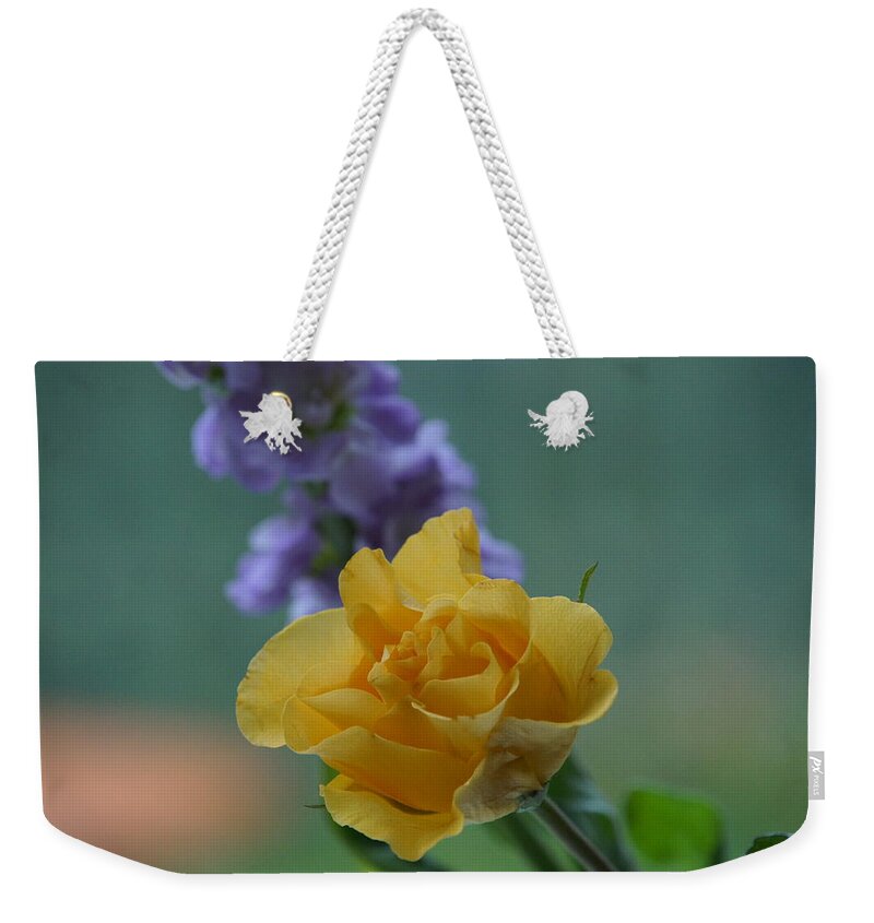 Floral Weekender Tote Bag featuring the photograph On the window sill. by Elena Perelman