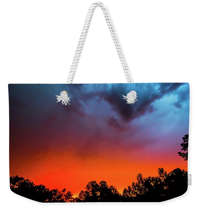 Alabama Weekender Tote Bag featuring the photograph Opposing Forces of Sunset by James-Allen