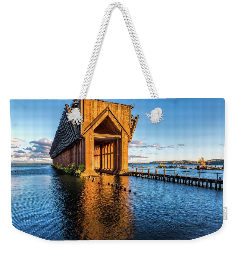 Water Weekender Tote Bag featuring the photograph Ore Dock by Joe Holley