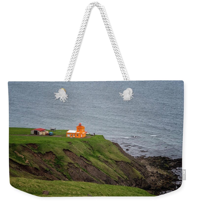 Iceland Weekender Tote Bag featuring the photograph Orange Lighthouse by Tom Singleton