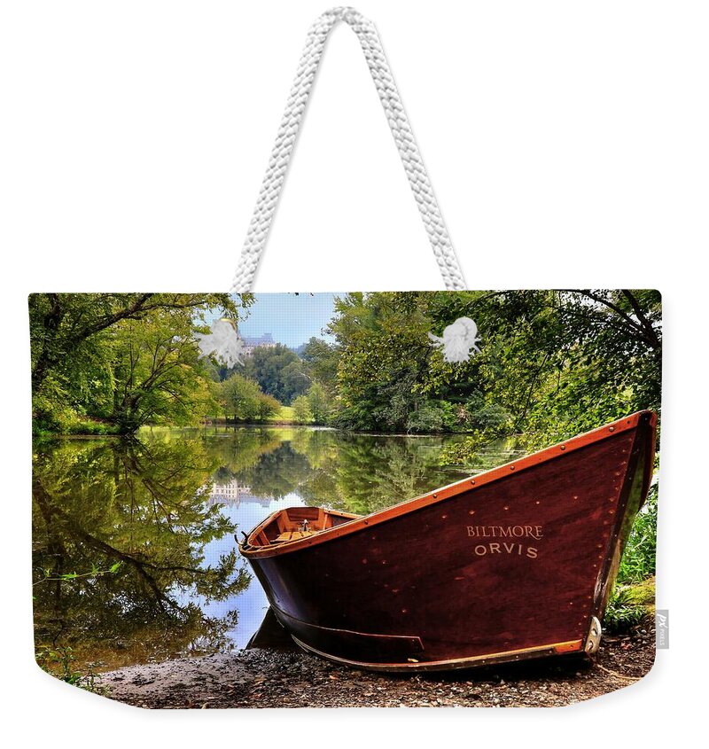 Biltmore Weekender Tote Bag featuring the photograph Orvis Rowboat And Biltmore Reflection by Carol Montoya