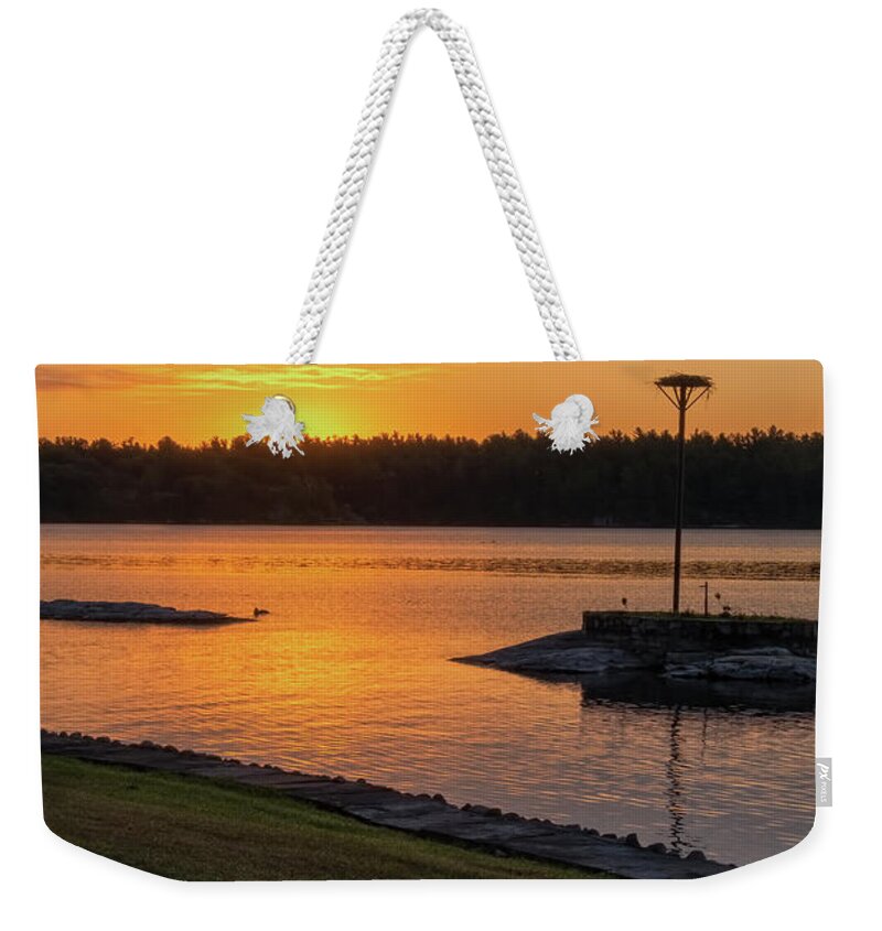 St Lawrence Seaway Weekender Tote Bag featuring the photograph Osprey Nest At Dawn by Tom Singleton
