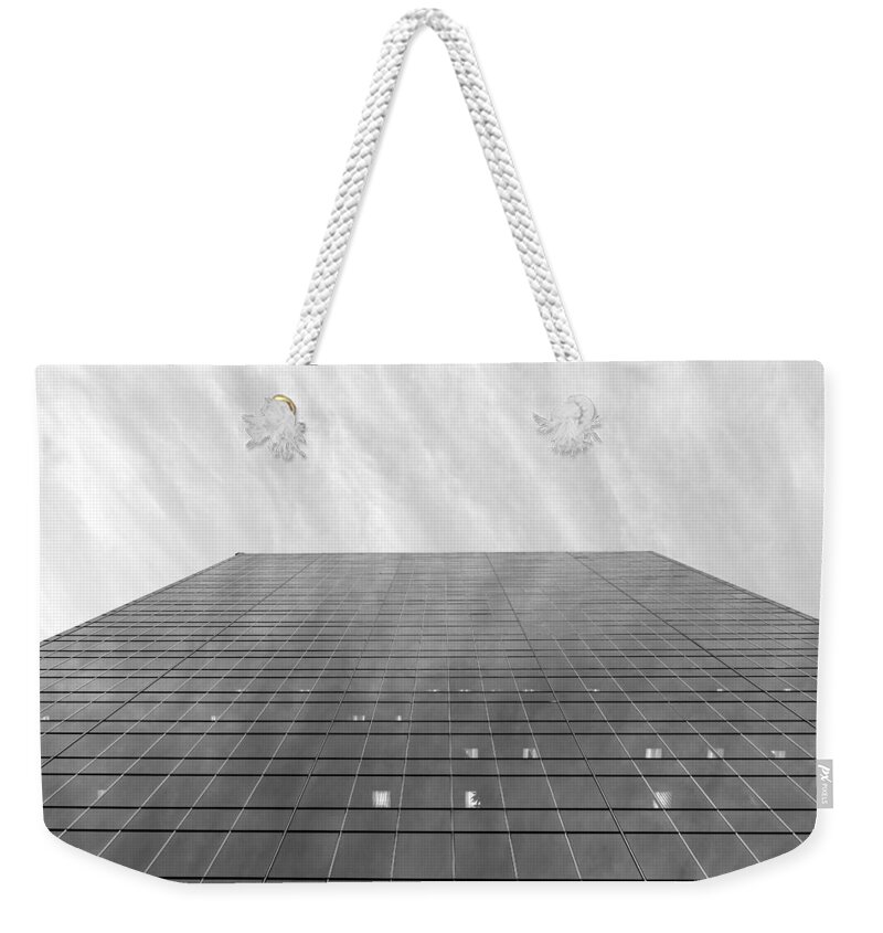 Sky Weekender Tote Bag featuring the photograph Over the City by Valentino Visentini
