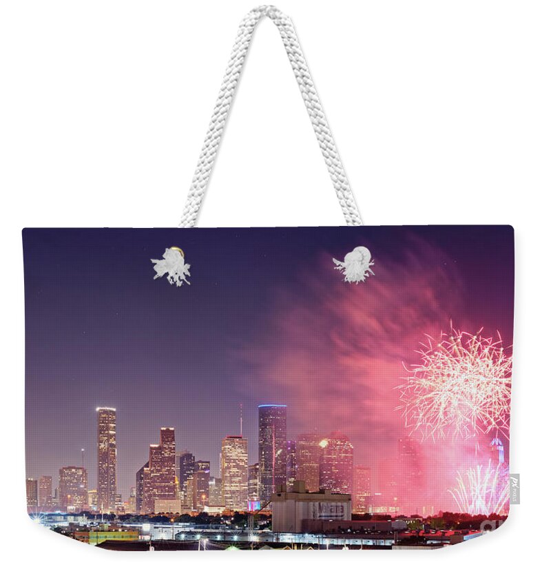 Downtown Weekender Tote Bag featuring the photograph Panorama of Downtown Houston Skyline Fireworks on the 4th of July - Harris County Texas by Silvio Ligutti