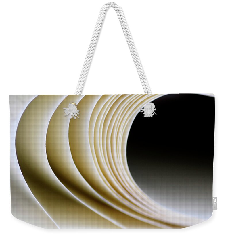 Paper Weekender Tote Bag featuring the photograph Paper Curl by Pedro Cardona Llambias