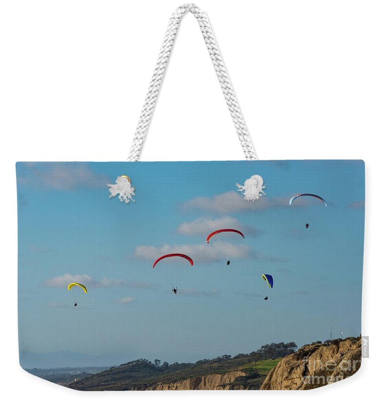 Beach Weekender Tote Bag featuring the photograph Paragliders at Torrey Pines Gliderport by David Levin